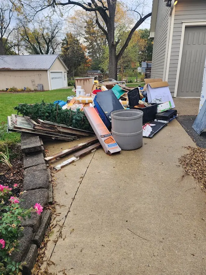 Dumpster being loaded with debris for Roofing Dumpster Rental in Salem
